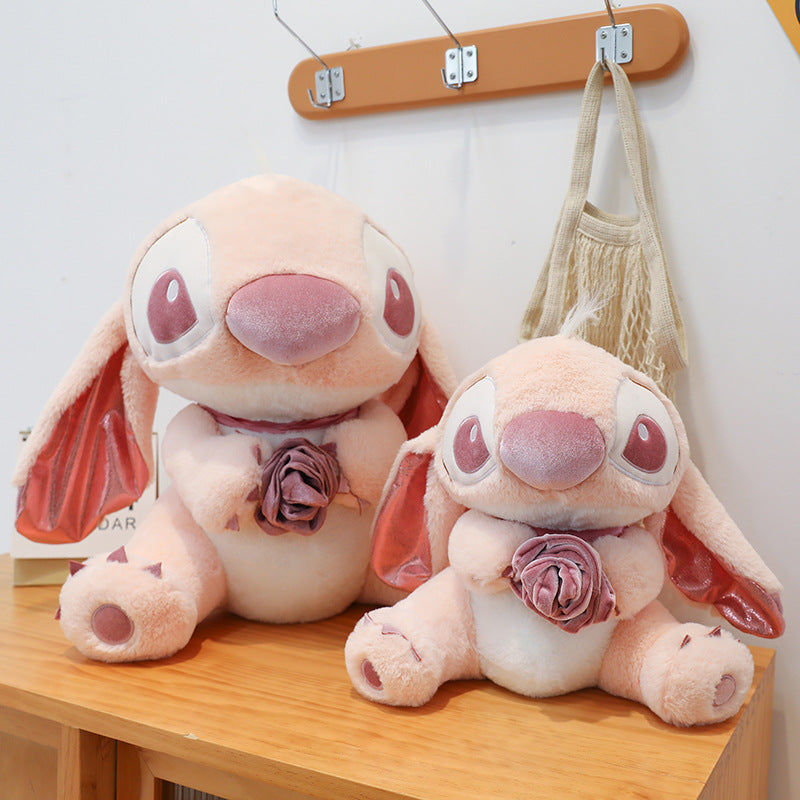 柔らかくてかわいいピンクのスティッチエンジェルのぬいぐるみ（花付き）