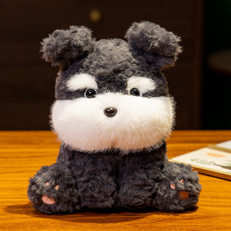 かわいい黒いふわふわのぬいぐるみの犬