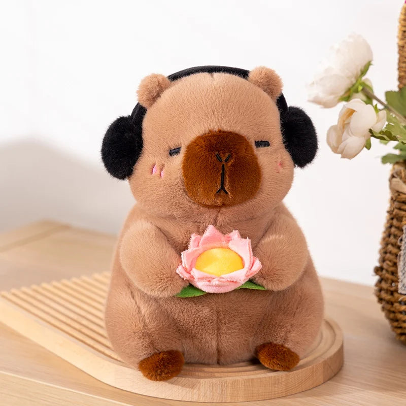 カボチャを被った黄色い目の黒いぬいぐるみ