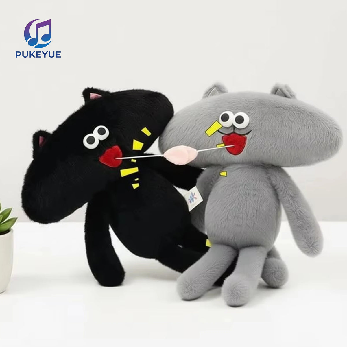 ユニークな顔のふわふわぬいぐるみ 黒とグレーのペア