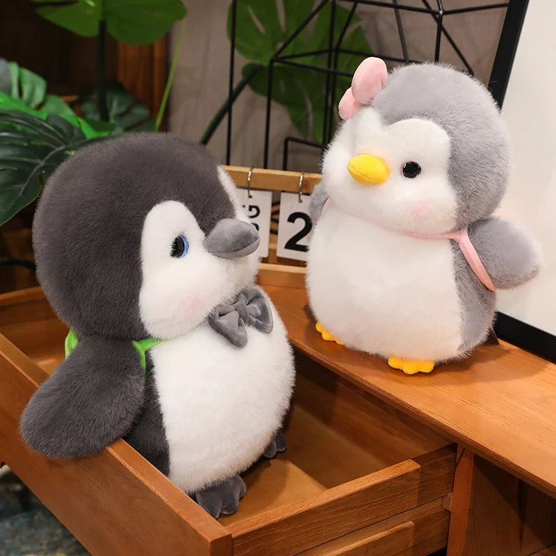 ふわふわ ぽっちゃり ピンク リボン の グレー ペンギン ぬいぐるみ