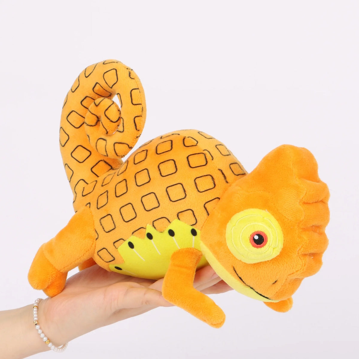 オレンジ色カメレオン ぬいぐるみ 四角い鱗模様の巻いた尻尾