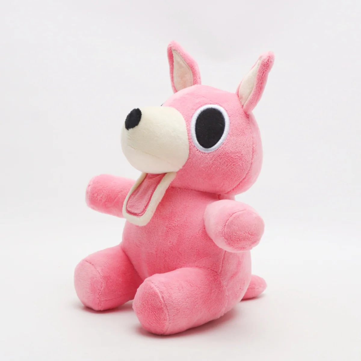 明るいピンクの口を開けたうさぎぬいぐるみ