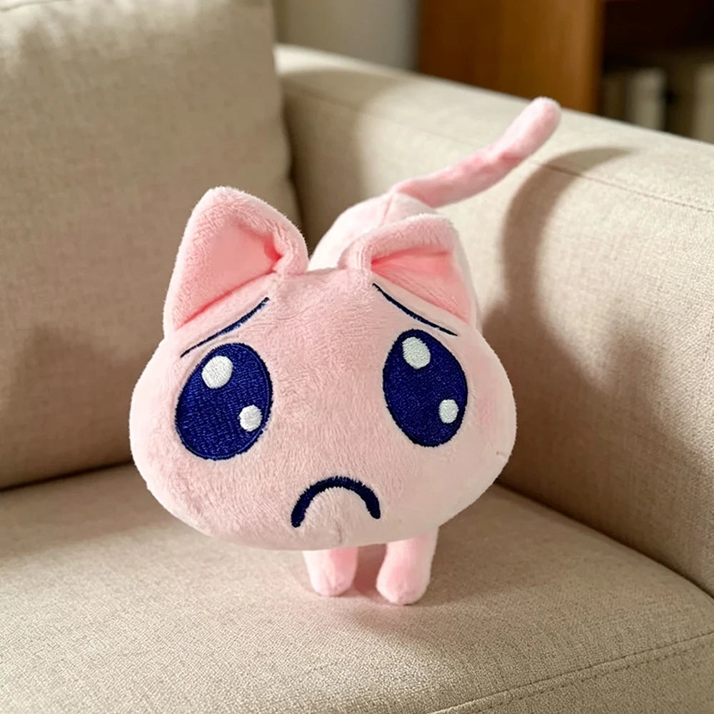 ふわふわなピンクの困り顔ネコぬいぐるみ