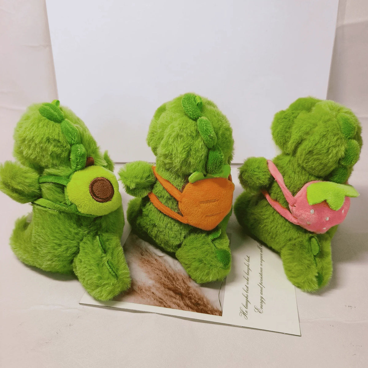 13cm Adorable Skipping School Dinosaur Plush Toys A Strawberry, Avocado and Carrot Dinosaur Pendant On the Back Toys for Kids