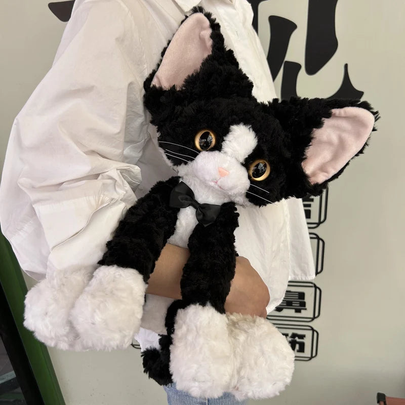 もこもこ耳長猫ぬいぐるみ 青い瞳とピンクのリボン