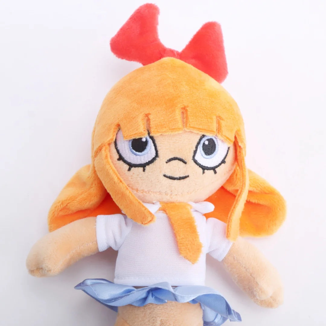 赤いリボンと青い目のオレンジ髪の女の子ぬいぐるみ