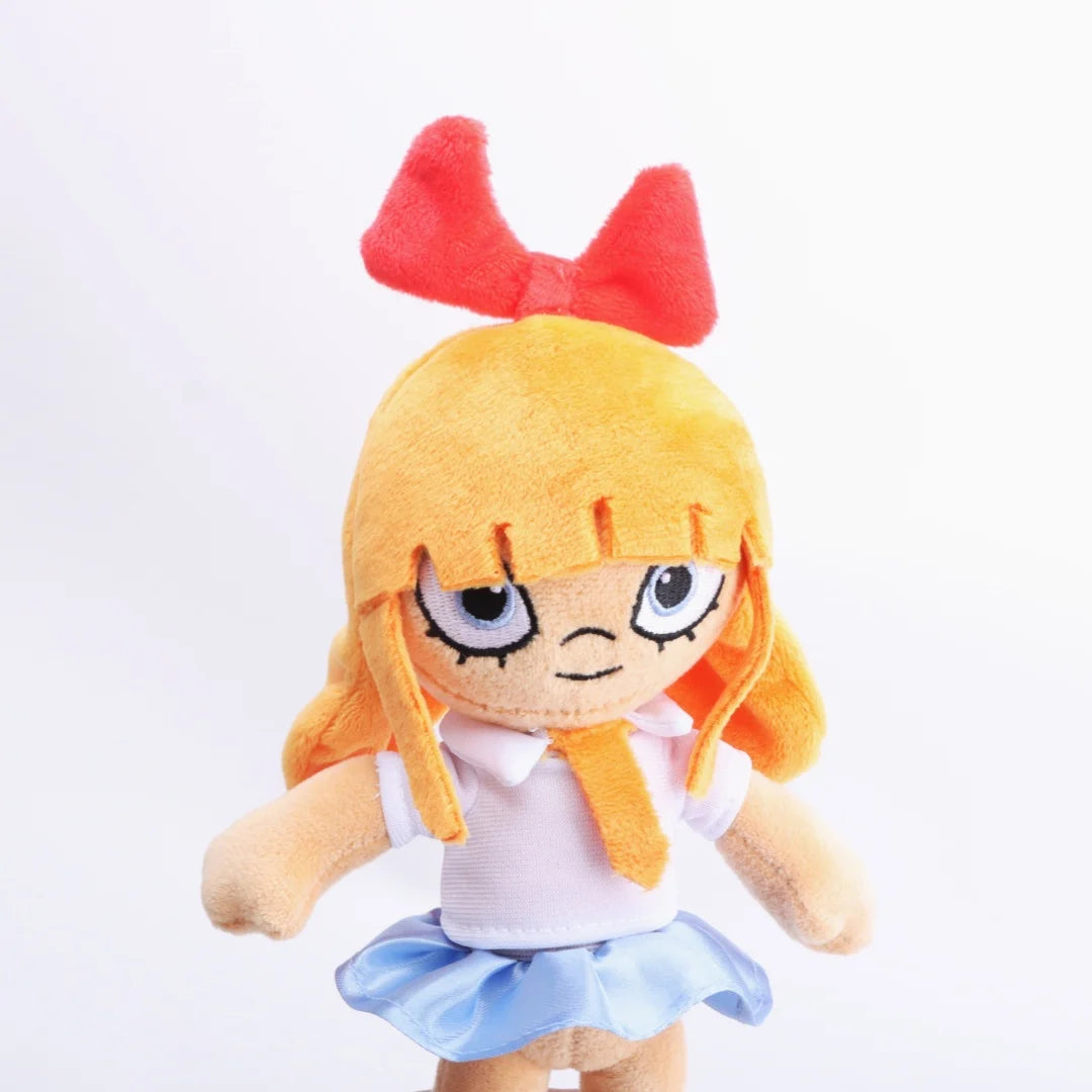 赤いリボンと青い目のオレンジ髪の女の子ぬいぐるみ