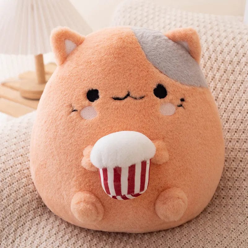ポップコーンを食べるぬいぐるみの猫