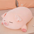 横になって眠っているピンクのぬいぐるみの豚、75cm