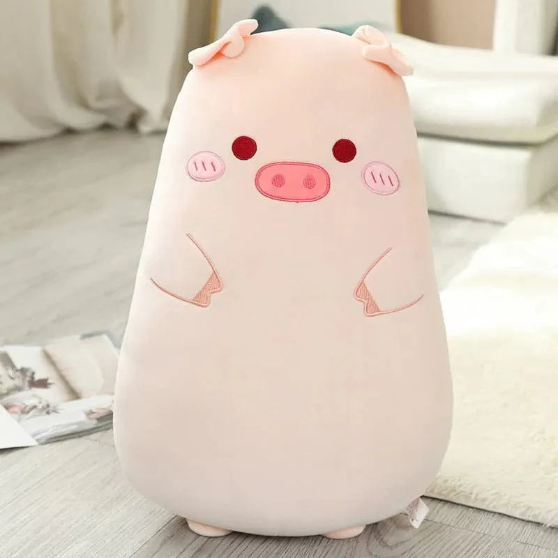 丸い目をした淡いピンクのスクイシュマロ豚のぬいぐるみ