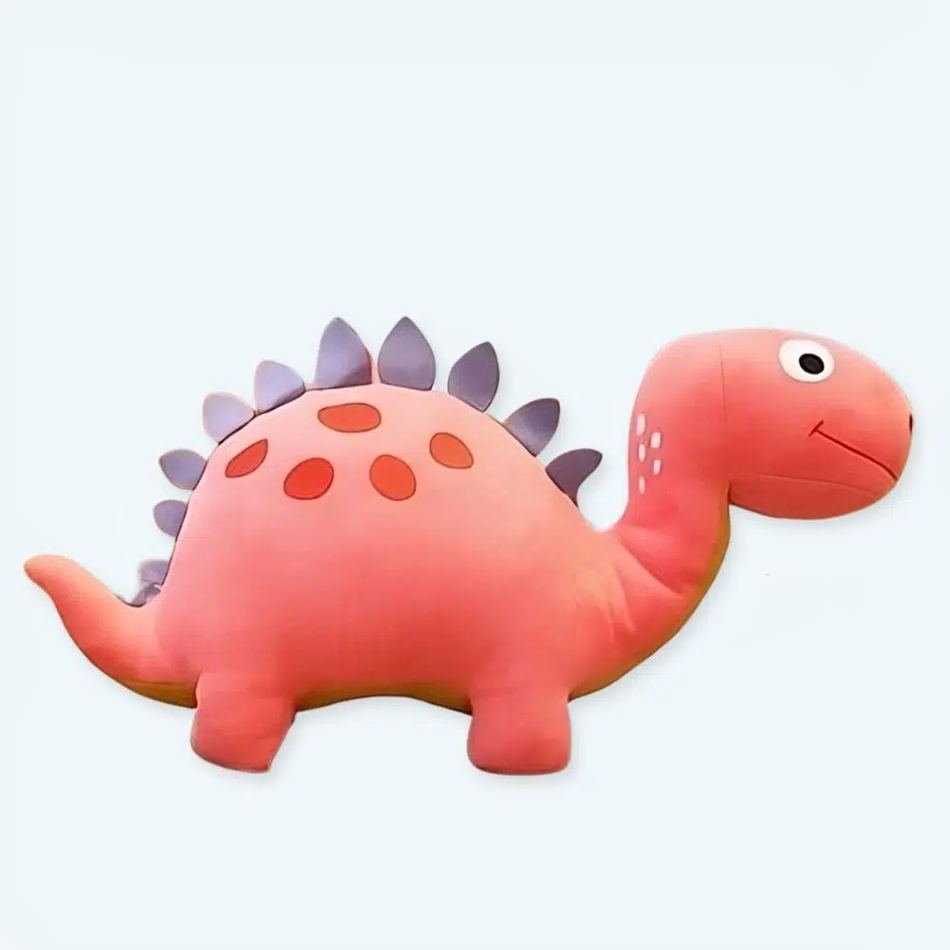 寝室でお子様を優しく抱きしめる、楽しいピンクの恐竜のぬいぐるみ。The Plush Company