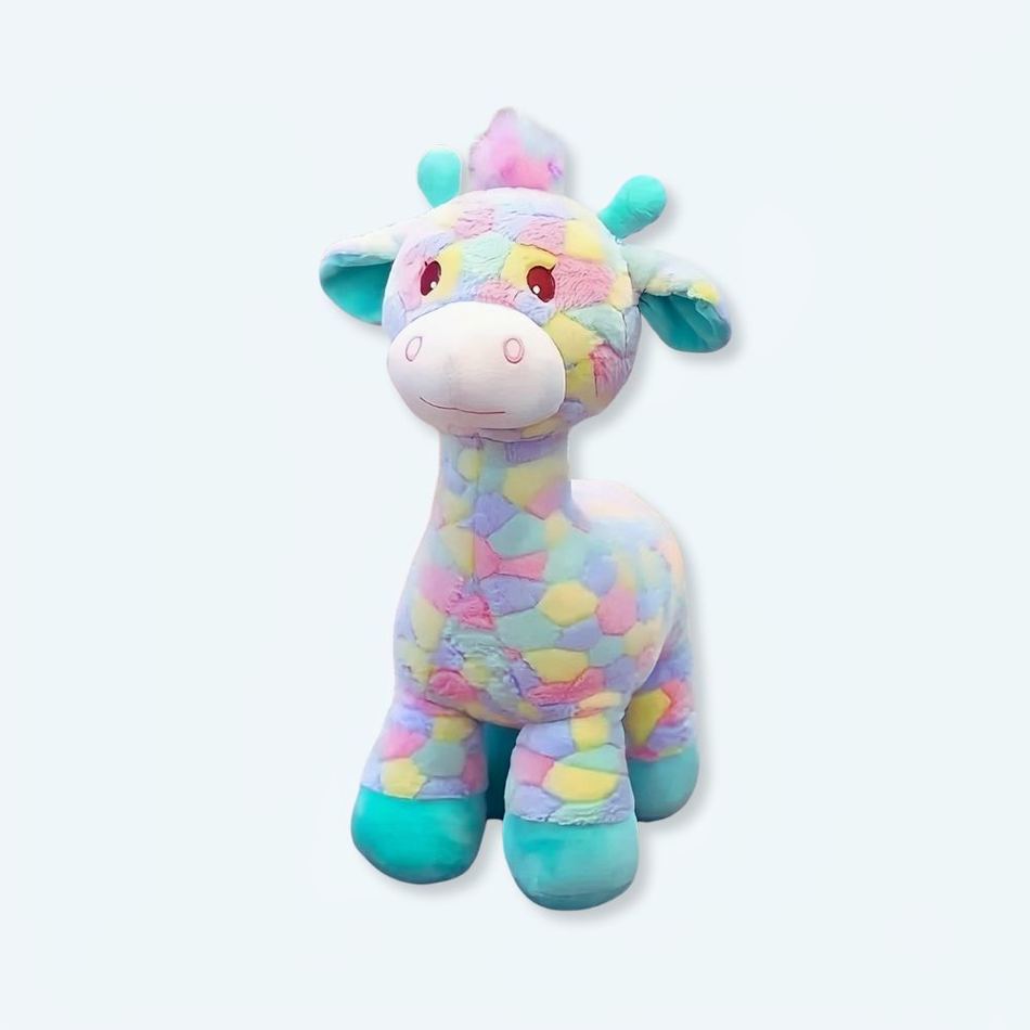 お子様のカラフルな寝室にぴったりの、柔らかい虹色のキリンのぬいぐるみ。The Plush Company