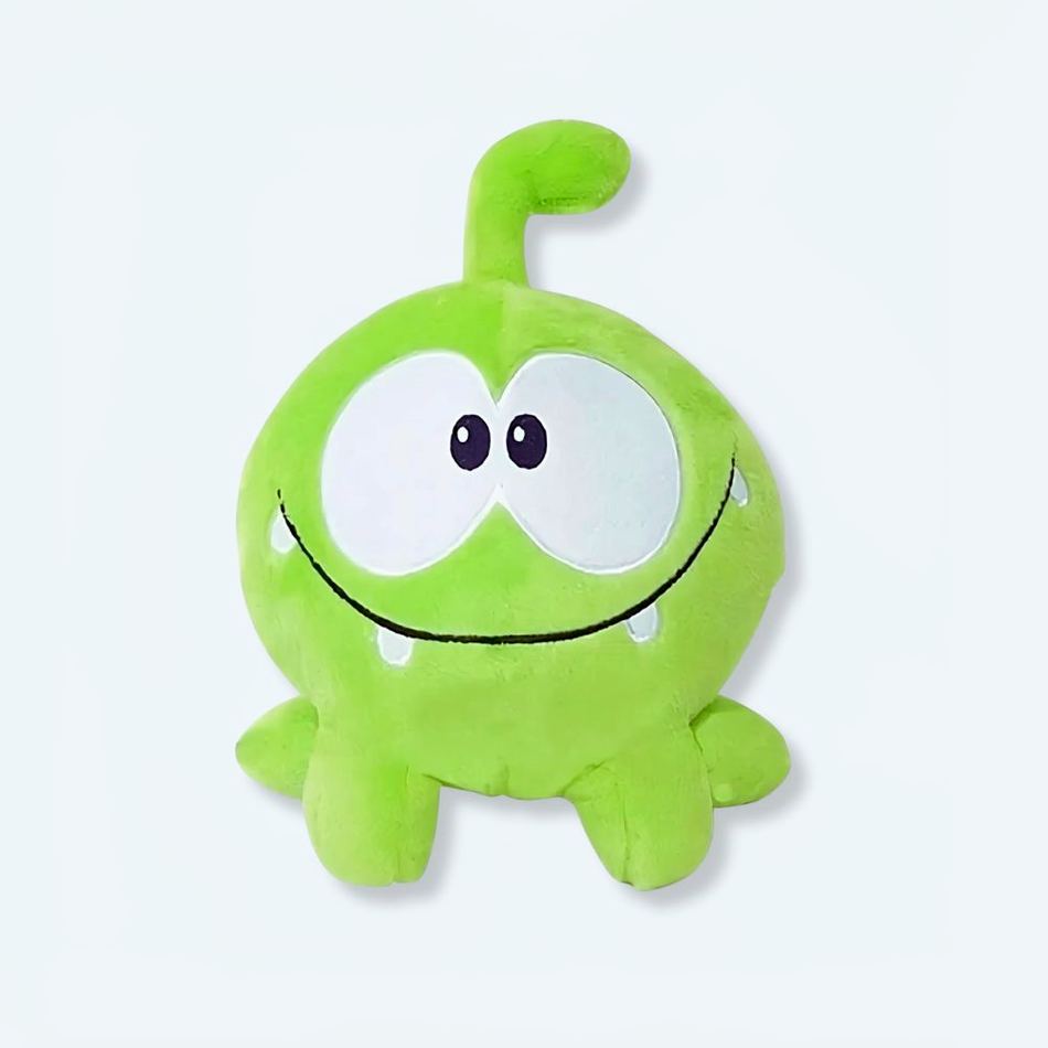 柔らかい緑色のOm Nomカエルのぬいぐるみ、子供用、抱きしめたくなる、La Compagnie de la Peluche製