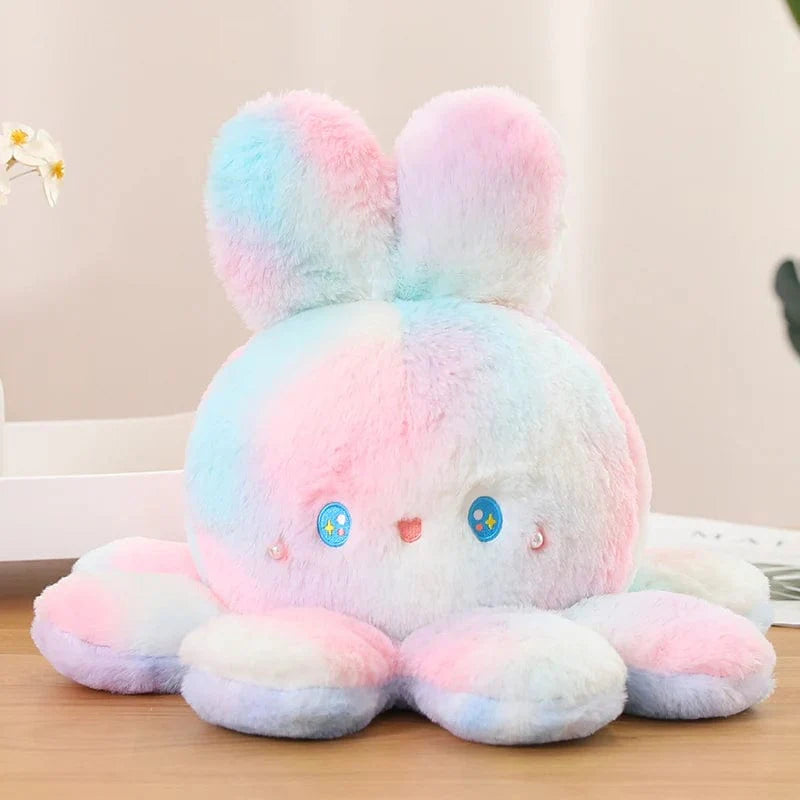 大きな耳が付いたリバーシブルぬいぐるみ。柔らかくてカラフル。ピンクからグリーン / 20cm
