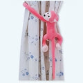 長くて優しい尻尾を持つ、柔らかいピンクのかわいい猿のぬいぐるみ - The Plush Company