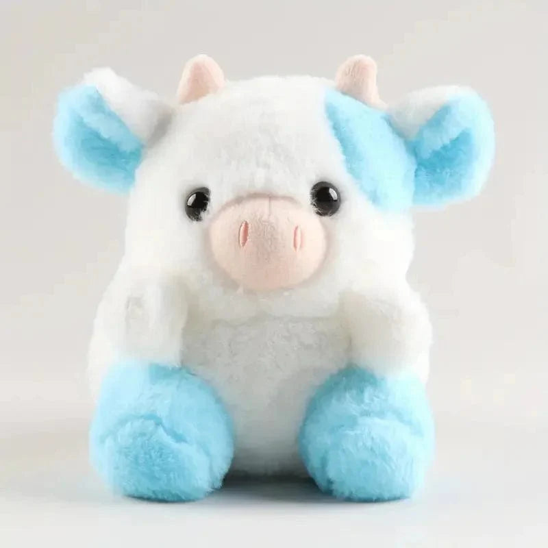 かわいくて柔らかい青と白の牛のぬいぐるみ